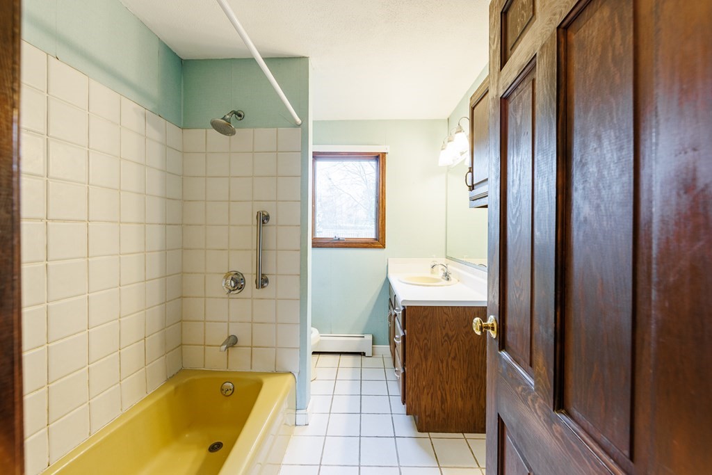 2 Lee Road Groveland, MA 01834 - Photo 26 of 41 a bathroom with a tub sink and mirror