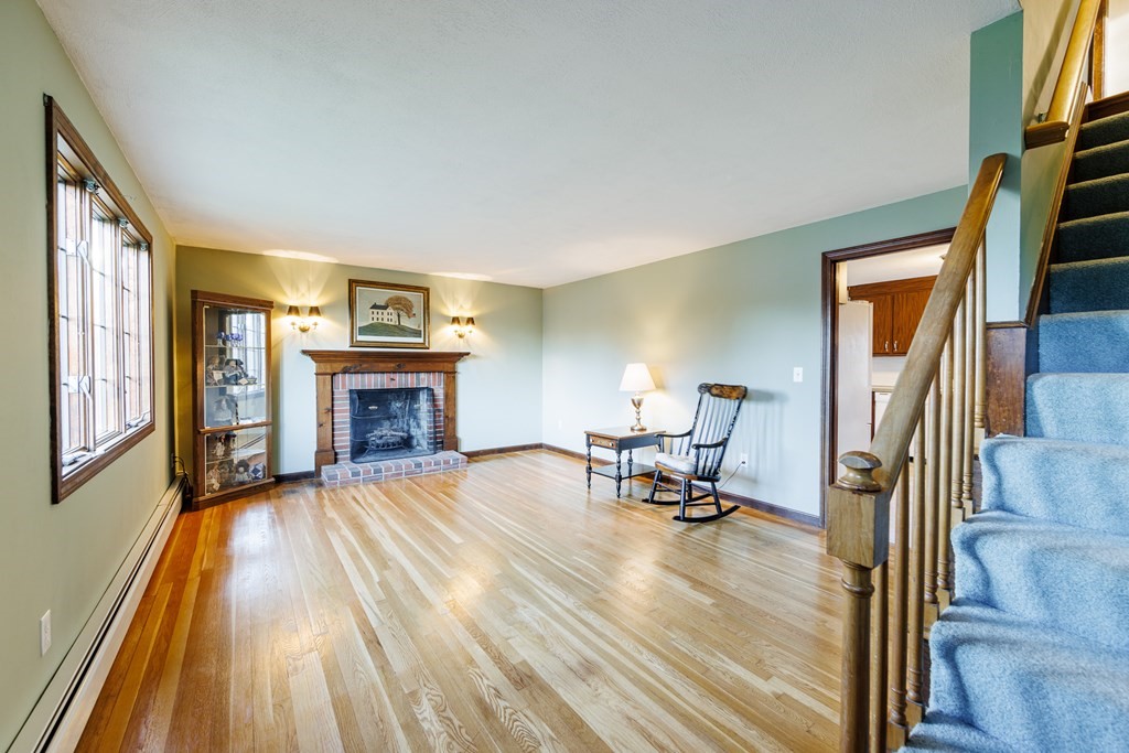 2 Lee Road Groveland, MA 01834 - Photo 31 of 41 a view of a livingroom with furniture and a fireplace