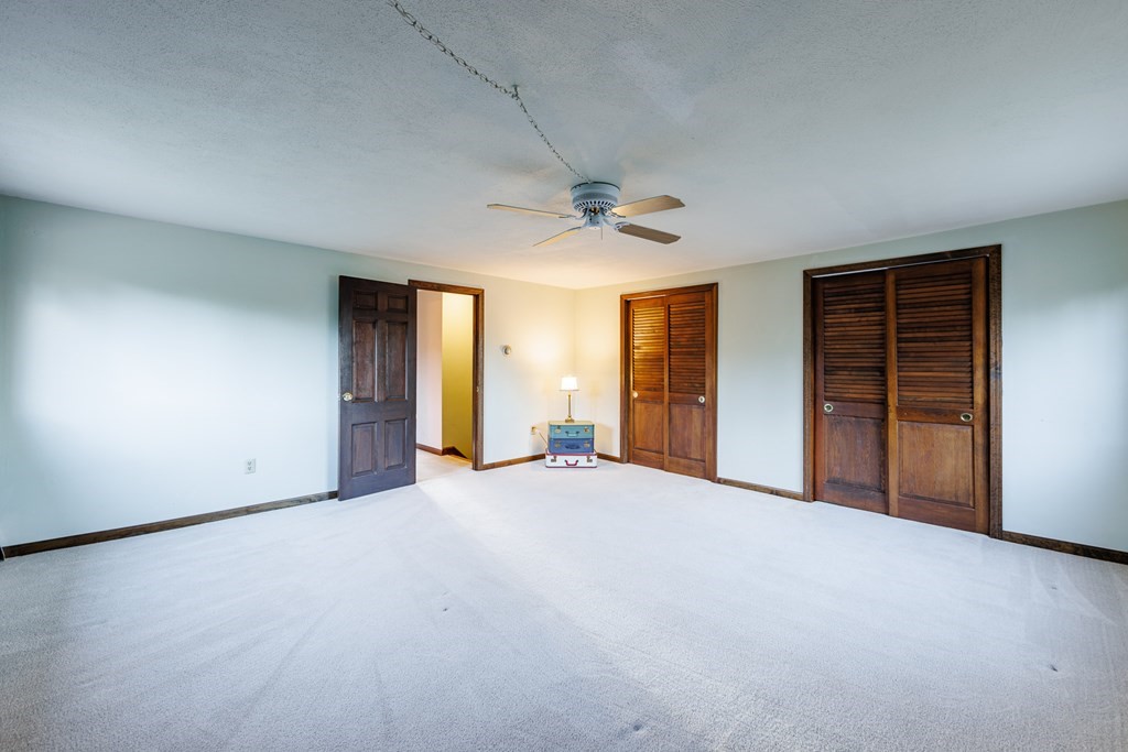 2 Lee Road Groveland, MA 01834 - Photo 36 of 41 an empty room with closet and a ceiling fan