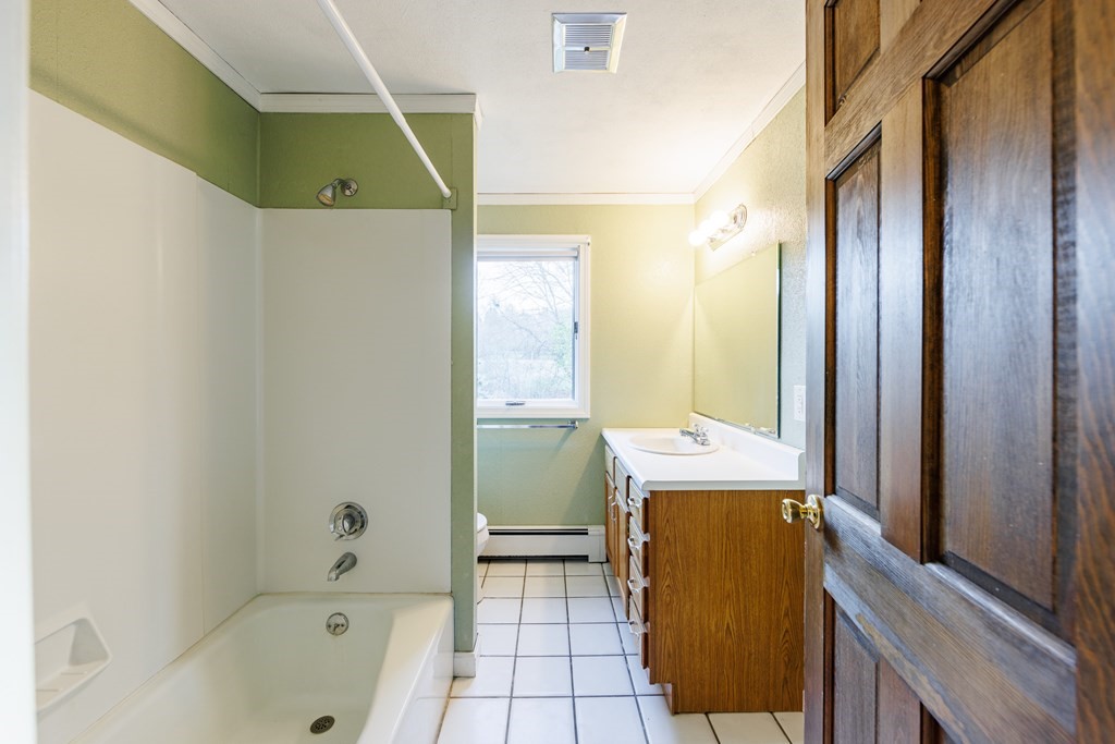 2 Lee Road Groveland, MA 01834 - Photo 39 of 41 a bathroom with a bathtub sink and mirror