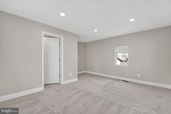 an empty room with a empty space and window