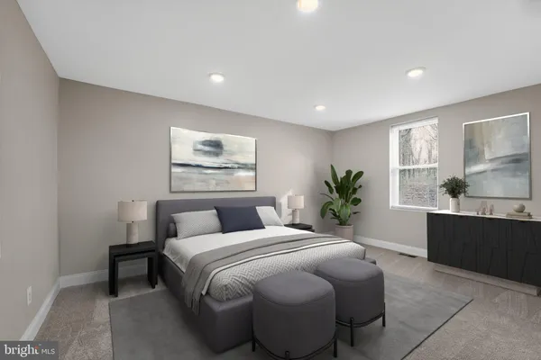 a bedroom with a large bed and a window