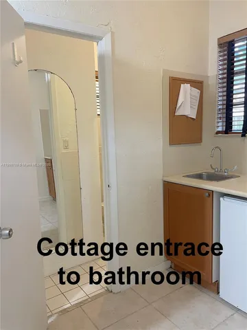 a bathroom with a mirror and a sink