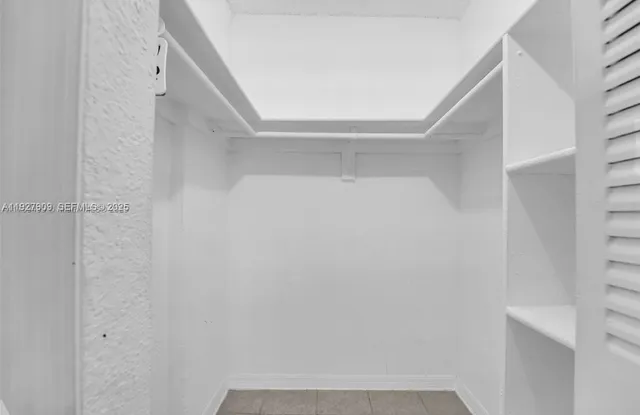 a view of staircase with white walls