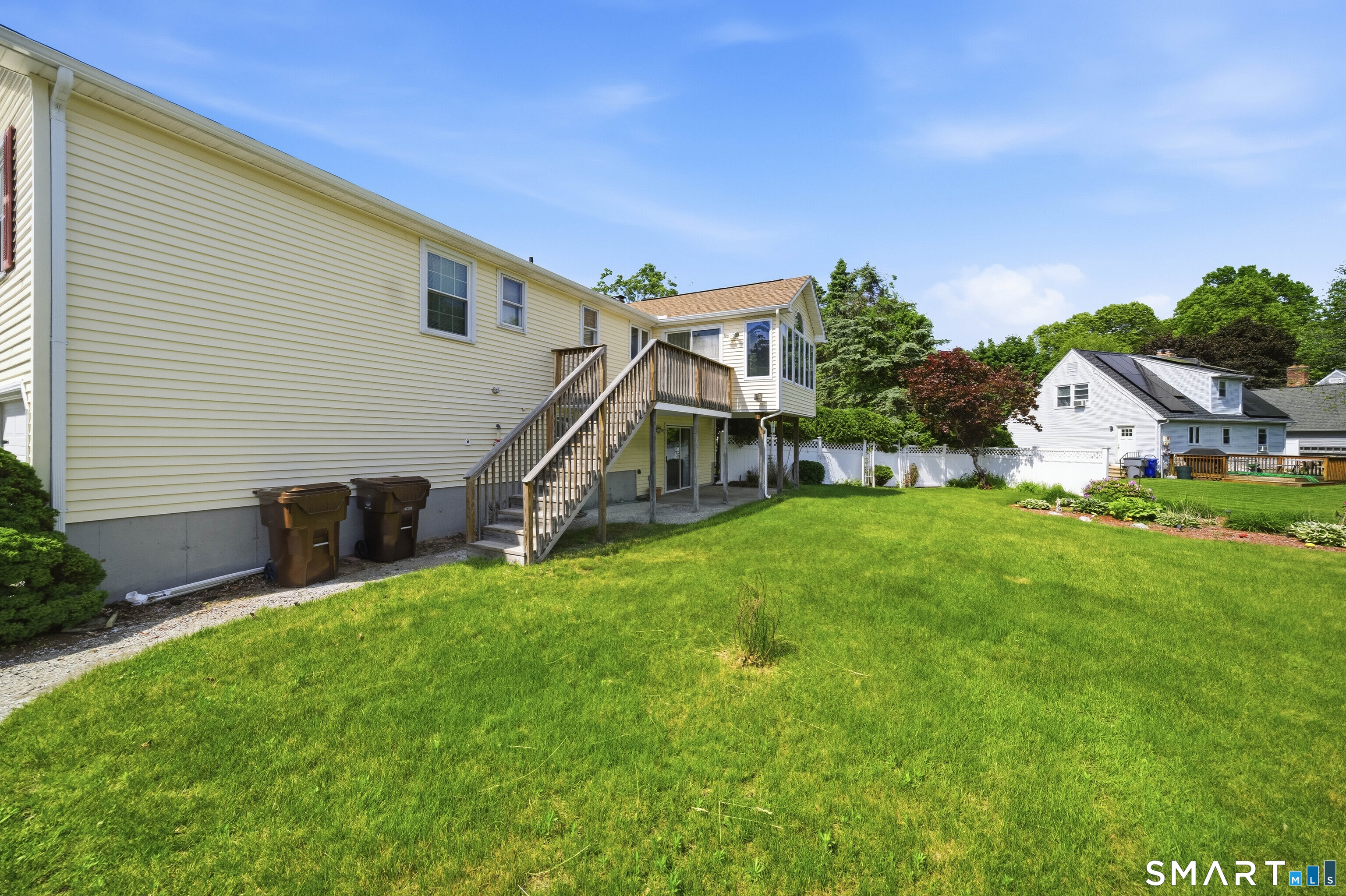 17 Spruceland Road Enfield, CT 06082 - Photo 5 of 40 Stairs leading to newer upper decking with slider/entrance into 4 season room