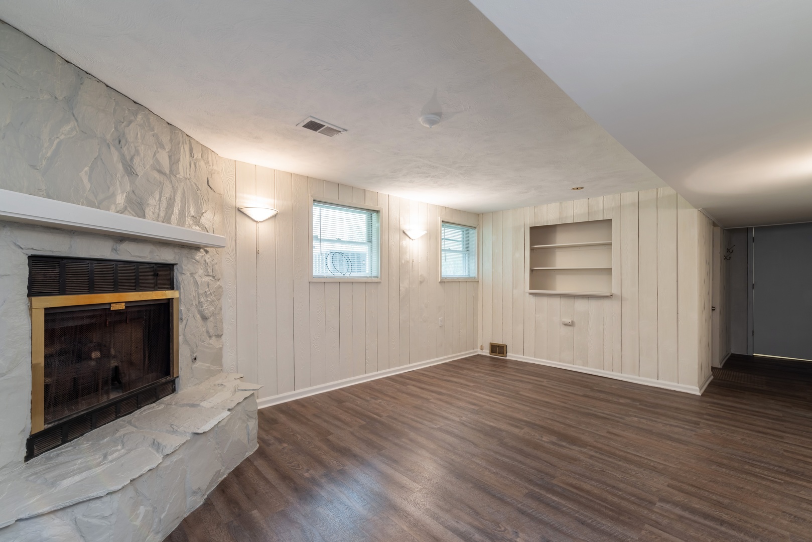 1682 Berkeley Road Highland Park, IL 60035 - Photo 11 of 15 a view of empty room with wooden floor and fireplace