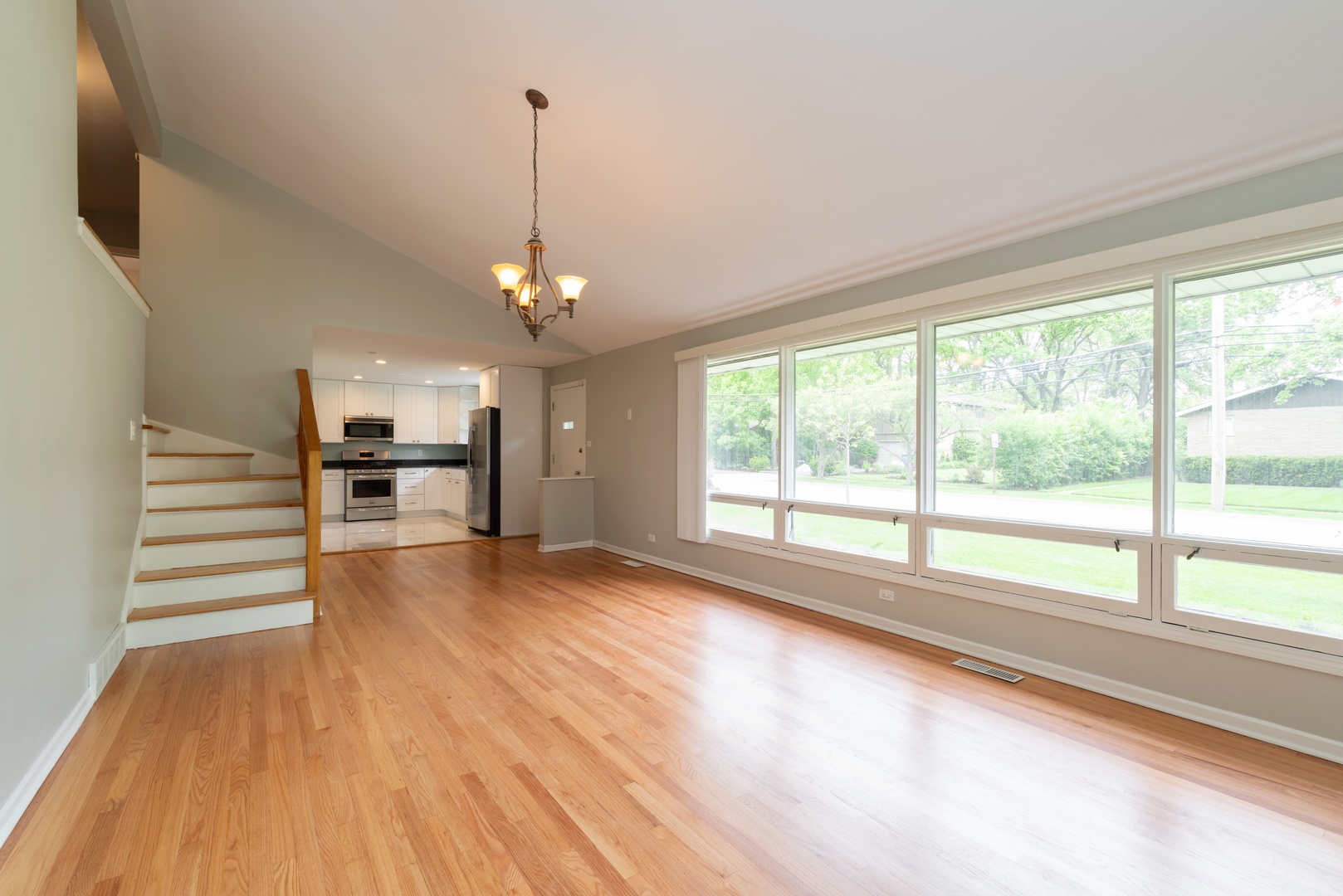 1682 Berkeley Road Highland Park, IL 60035 - Photo 3 of 15 a view of empty room with wooden floor and fan