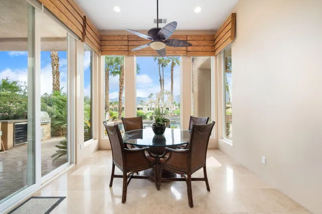 a view of a dining room with furniture wooden floor and chandelier