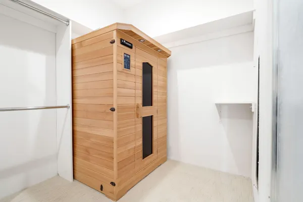 a bathroom with a shower sink and mirror
