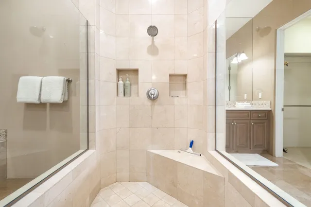 a bedroom with a bed and a lamp