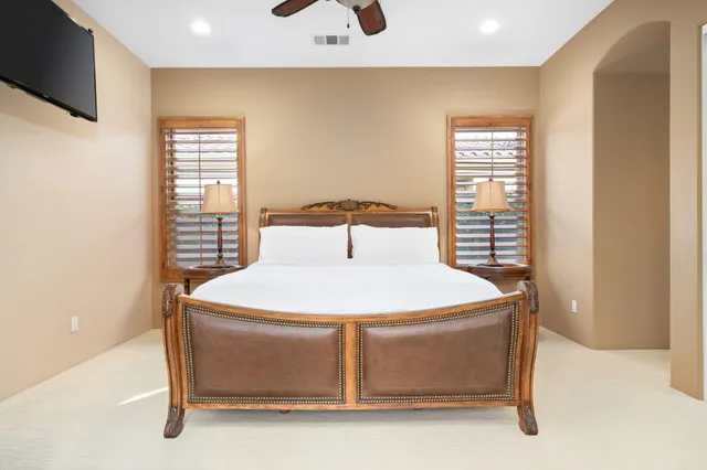 a bathroom with a shower sink and mirror
