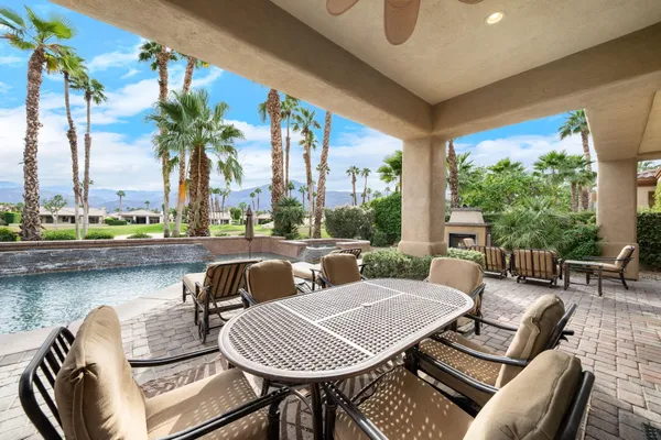 a view of a patio with swimming pool