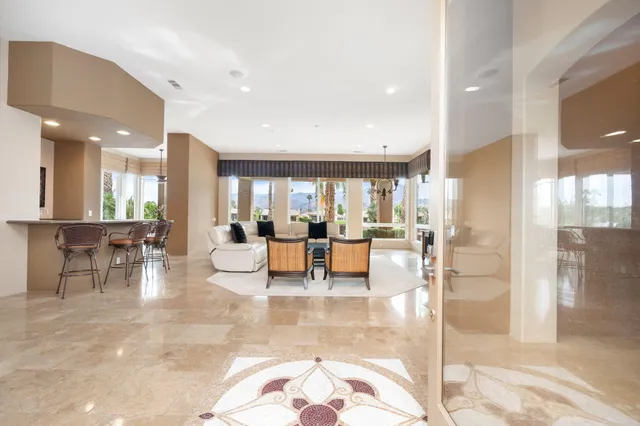a view of a lobby with table and chairs