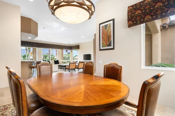a dining room with furniture and wooden floor
