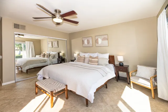 a bedroom with a bed and a couch