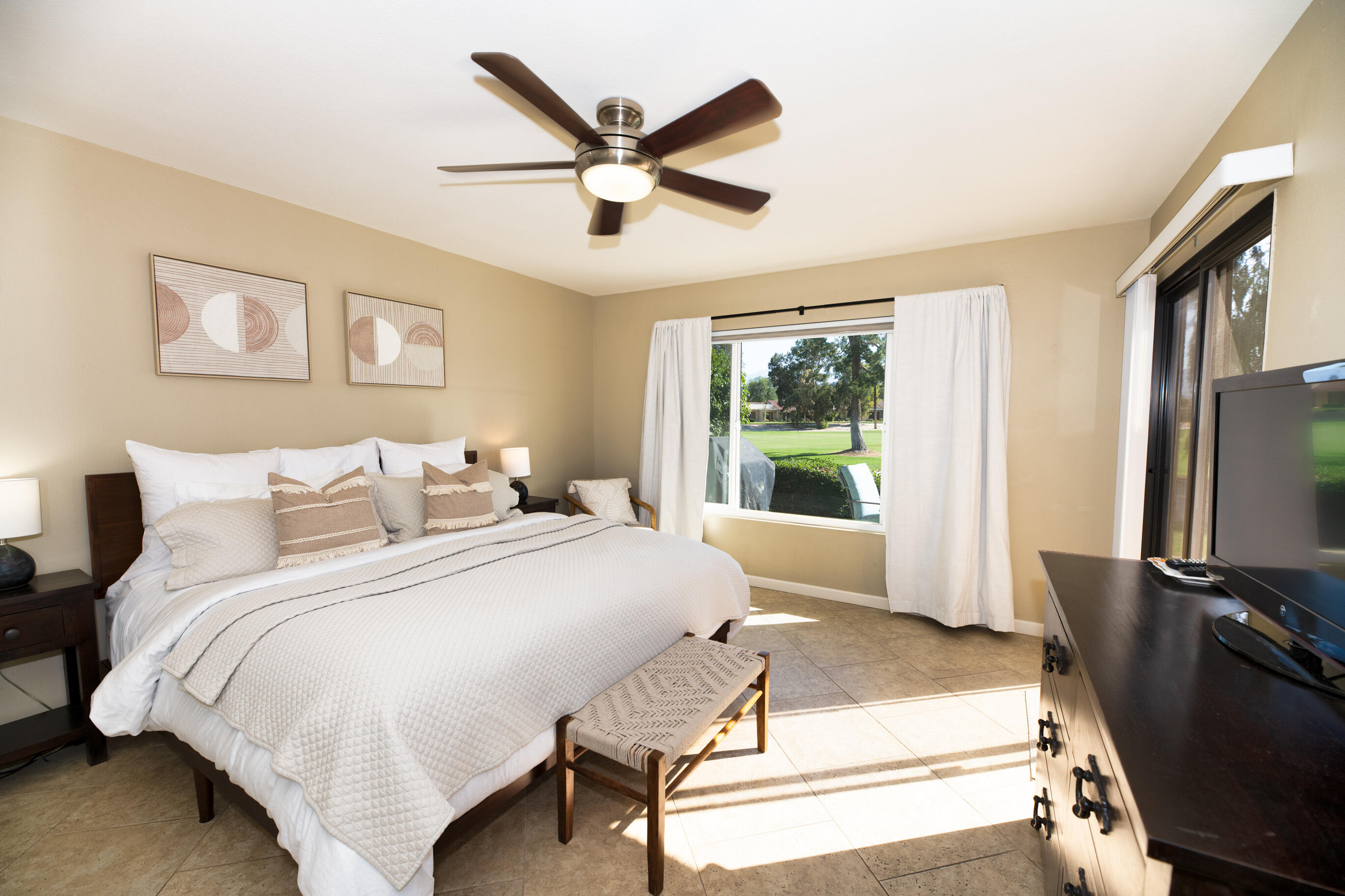 77361 Preston Trail Palm Desert, CA 92211 - Photo 2 of 47 a spacious bedroom with a bed and a flat screen tv