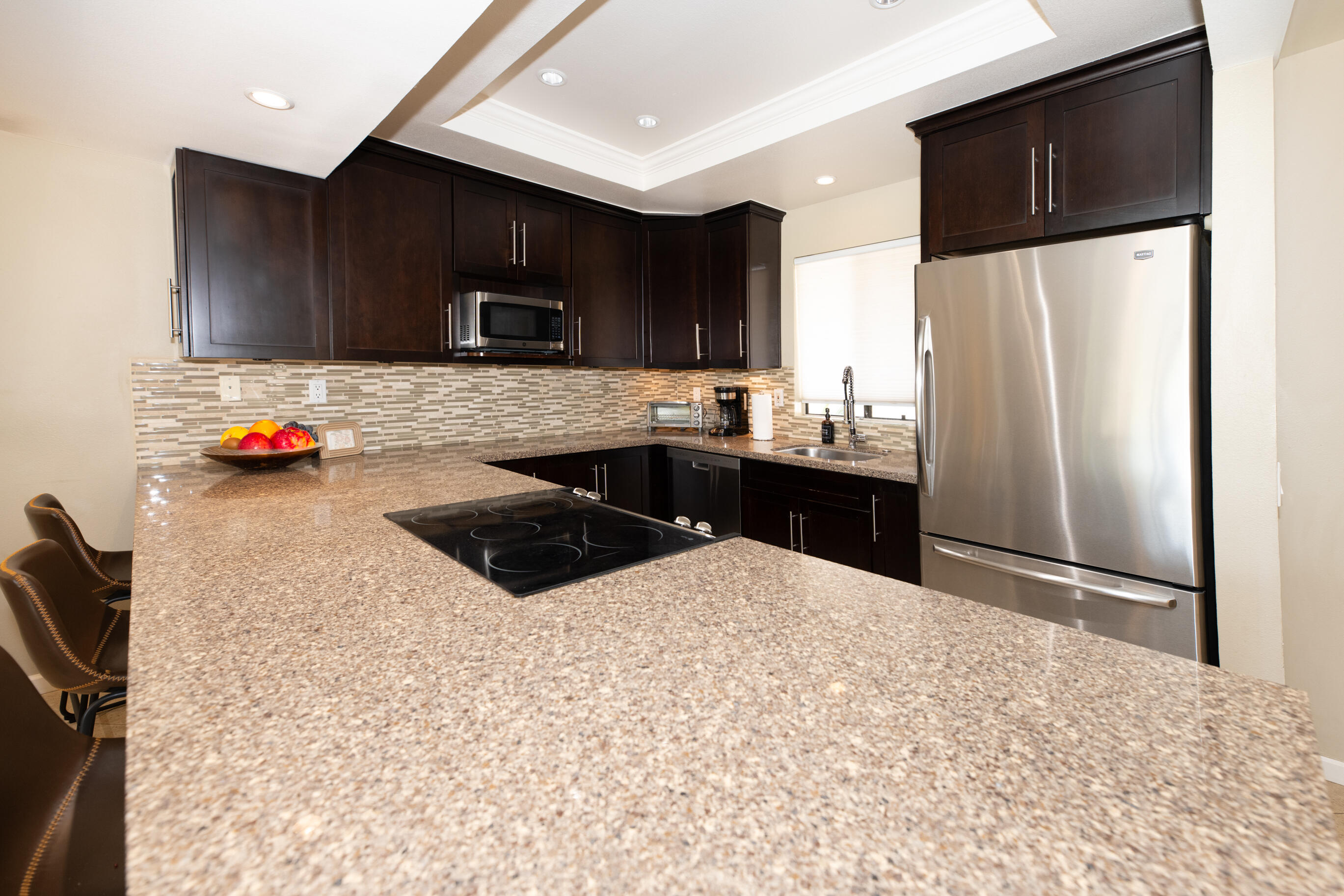 77361 Preston Trail Palm Desert, CA 92211 - Photo 24 of 47 a kitchen with stainless steel appliances a sink and a refrigerator