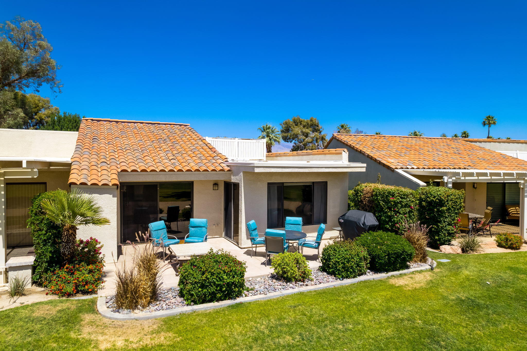77361 Preston Trail Palm Desert, CA 92211 - Photo 26 of 47 a view of a house with potted plants