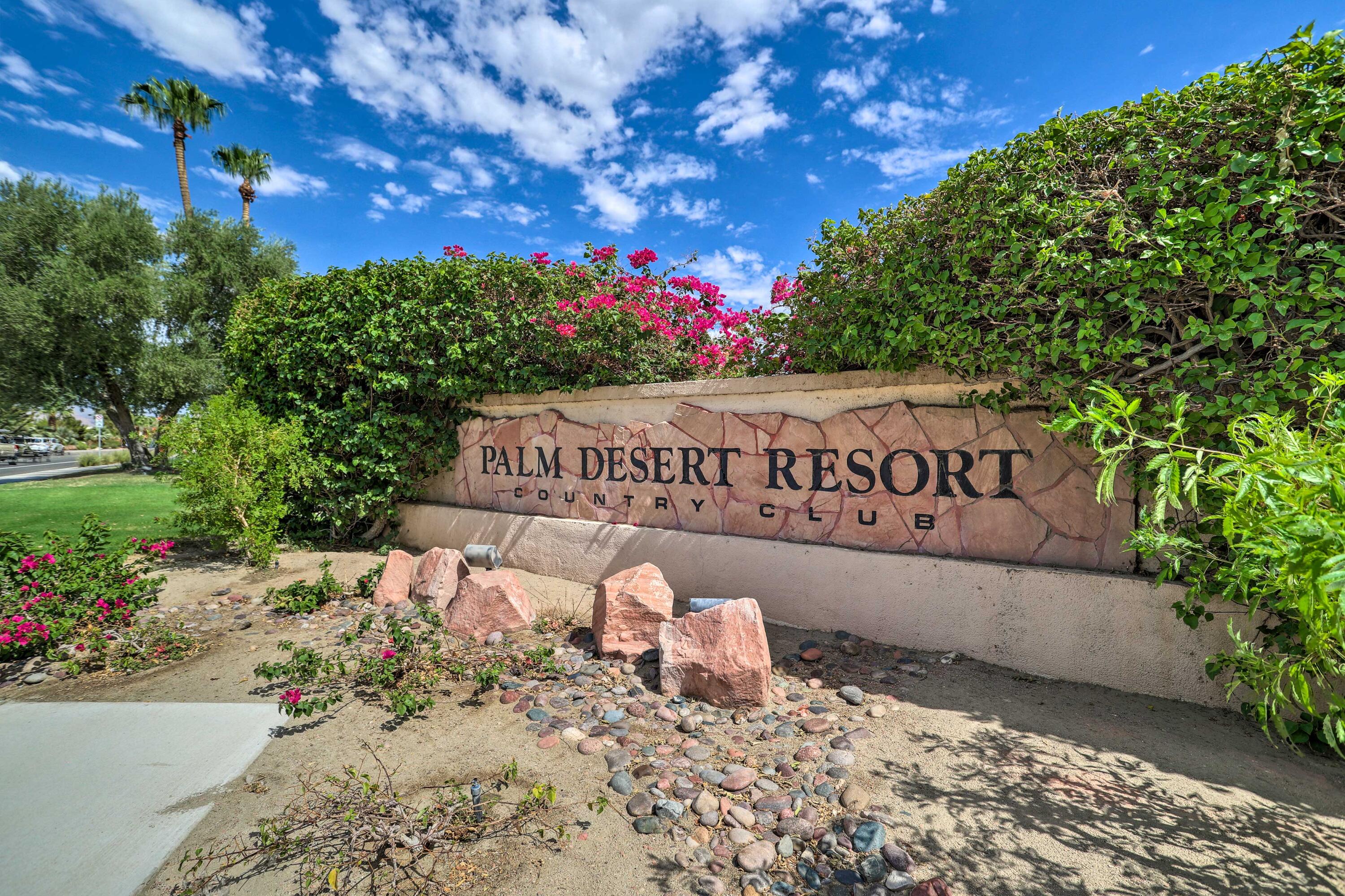 77361 Preston Trail Palm Desert, CA 92211 - Photo 27 of 47 a street sign in front of flowers
