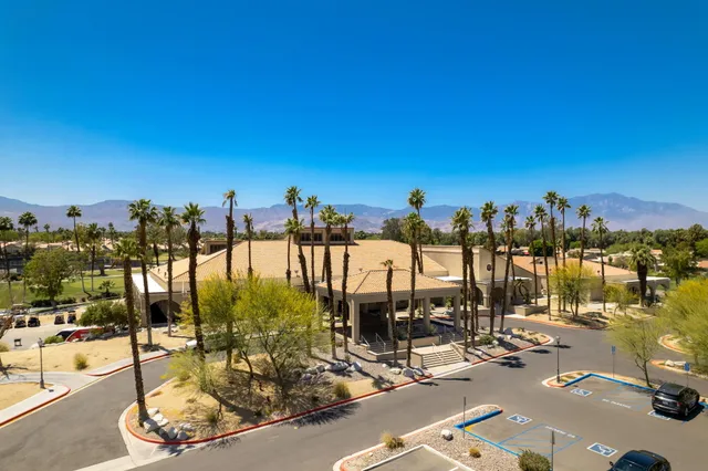 an aerial view of a house with a ocean view