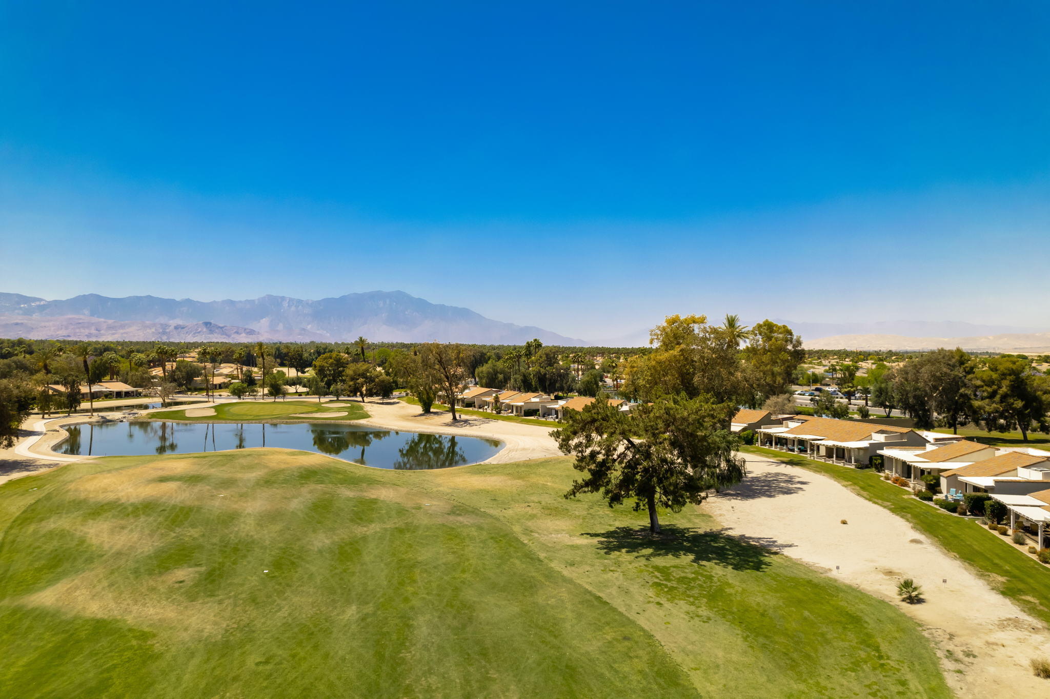 77361 Preston Trail Palm Desert, CA 92211 - Photo 40 of 47 a view of a swimming pool with an ocean view