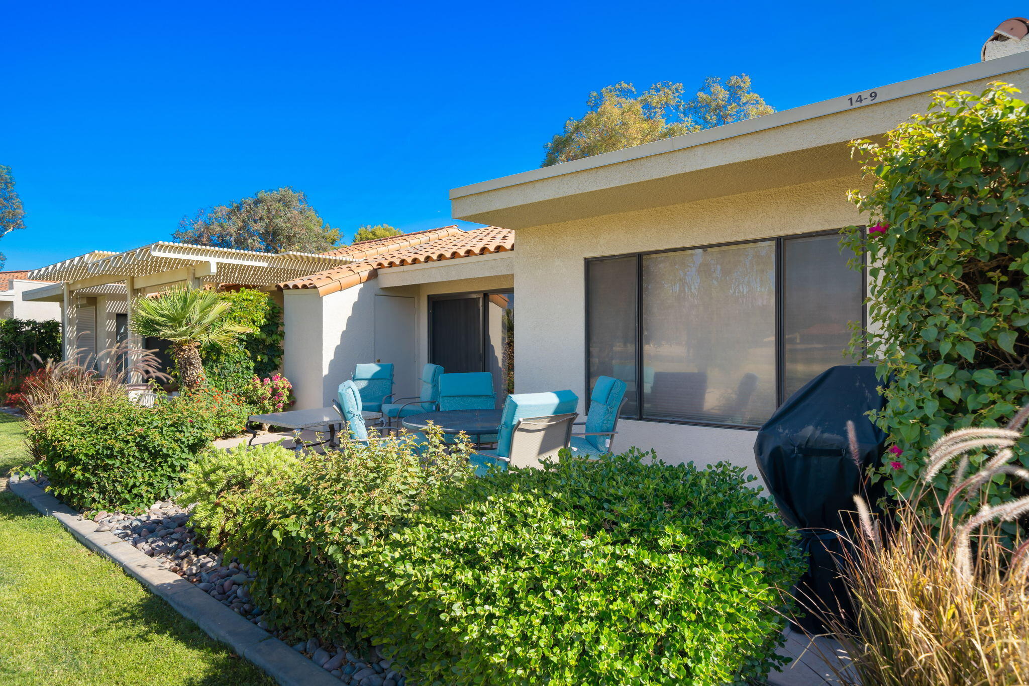 77361 Preston Trail Palm Desert, CA 92211 - Photo 45 of 47 a front view of a house with garden
