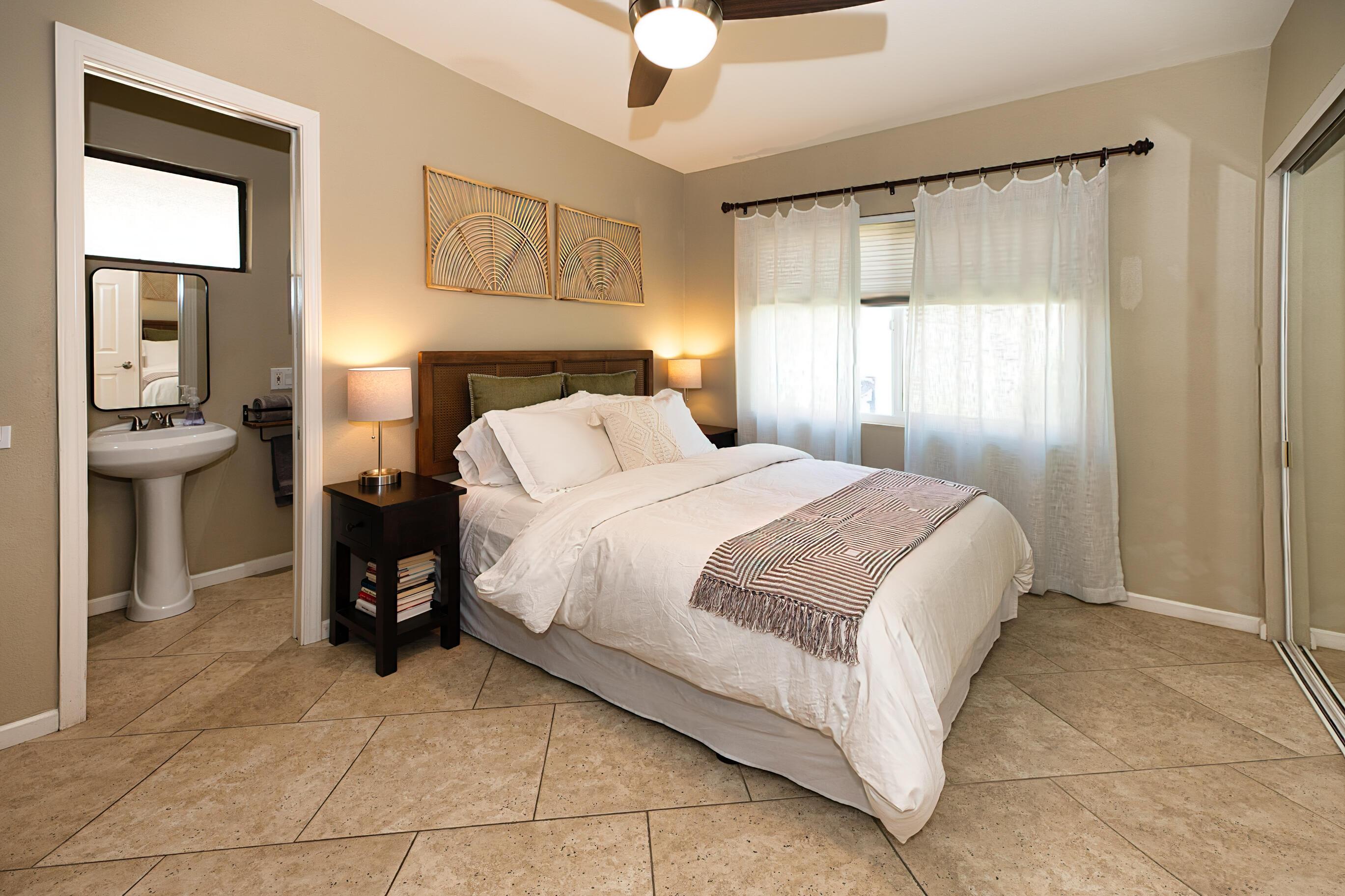 77361 Preston Trail Palm Desert, CA 92211 - Photo 6 of 47 a bedroom with a bed and a chandelier
