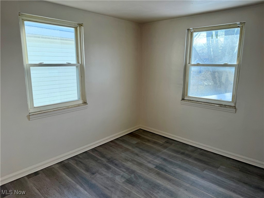 34 West Lewis Street Struthers, OH 44471 - Photo 3 of 14 Bedroom dark wood-style floors and healthy amount of natural light
