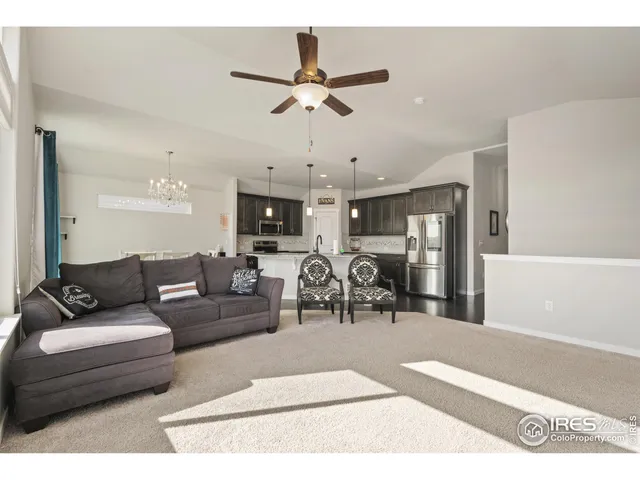 a living room with furniture and white walls