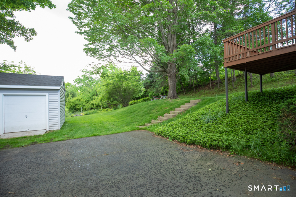 64 Somer Drive Meriden, CT 06451 - Photo 5 of 28 a view of a house with backyard and garden