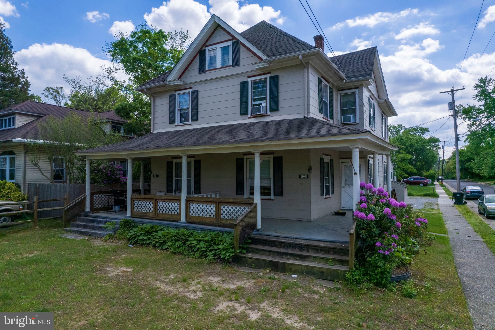 202 Cedar Avenue Pitman, NJ 08071 - Photo 3 of 27 a front view of a house with a garden