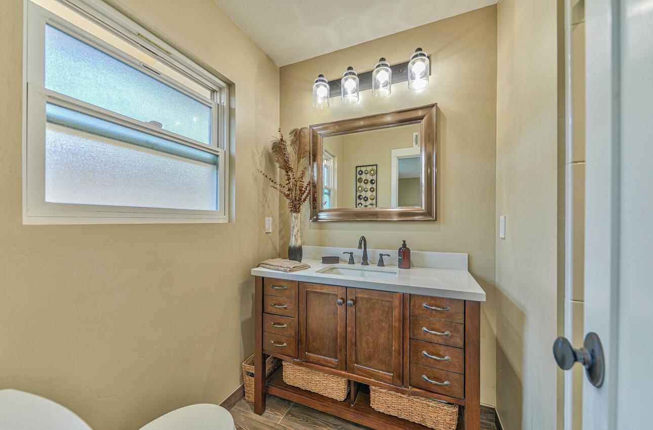 222 La Mesa Drive Salinas, CA 93901 - Photo 22 of 34 a bathroom with a toilet sink and mirror