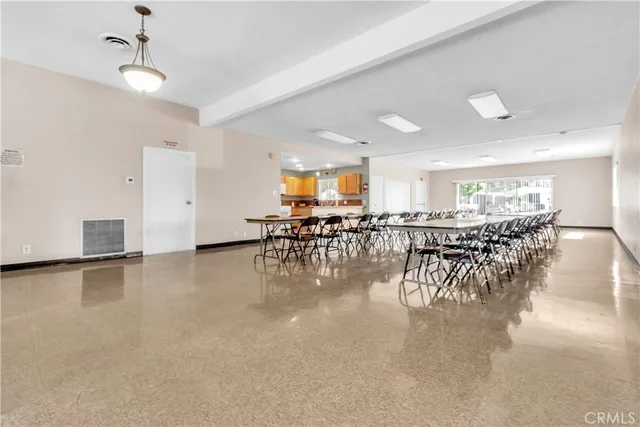 a lobby with furniture and wooden floor