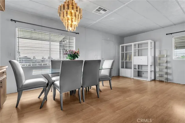 a view of a dining room with furniture and window