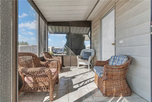 a outdoor living space with patio furniture and a potted plant