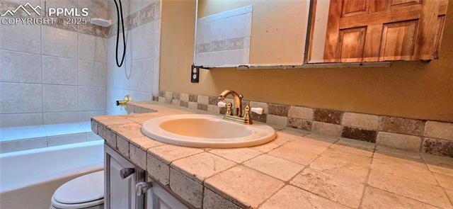 18170 Forest View Road Monument, CO 80132 - Photo 16 of 32 Full bath with toilet and vanity