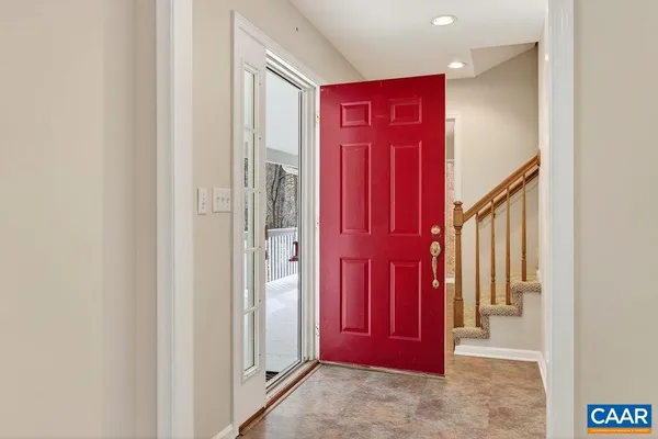 an empty room with furniture and a fireplace