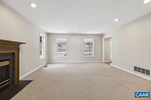 a kitchen with stainless steel appliances granite countertop wooden cabinets a sink and a refrigerator