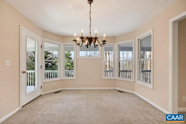 a kitchen with stainless steel appliances granite countertop wooden cabinets and a sink