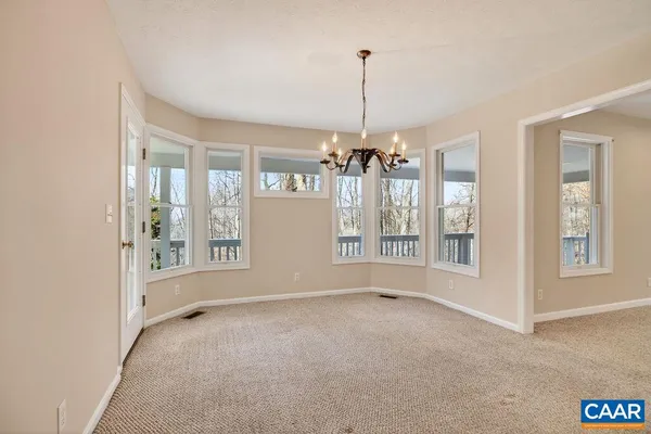 a kitchen with granite countertop a sink and a stove top oven with wooden floor