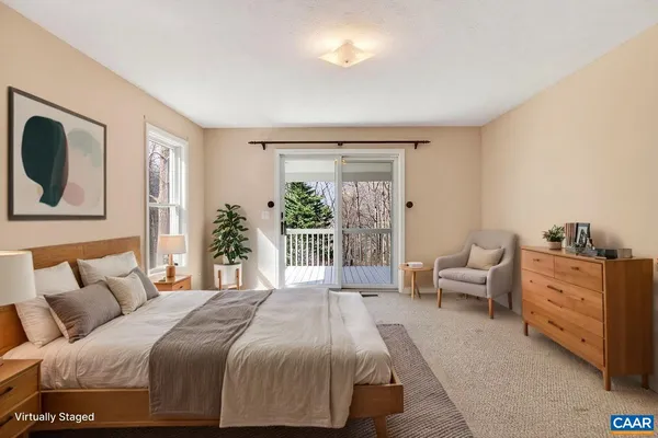 a view of a porch with wooden floor and front door