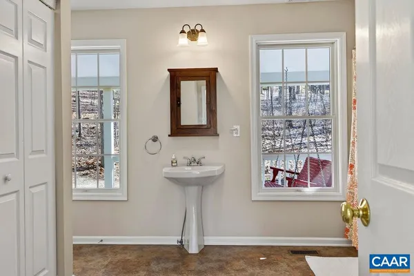 a view of an entryway with wooden floor
