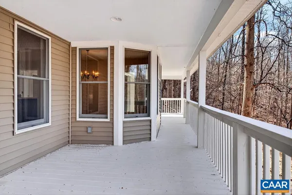 an empty room with a empty space and windows