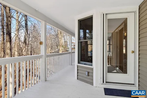 an empty room with a empty space and windows