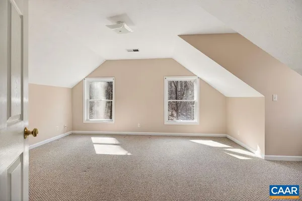 a view of an empty room with a balcony