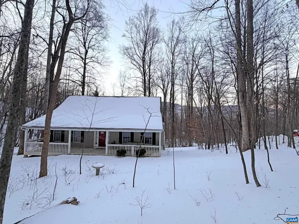 a front view of a house with parking space