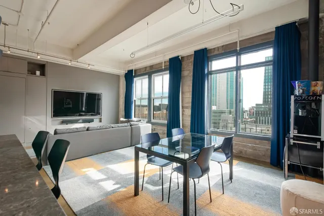 a view of a dining room with furniture window and outside view