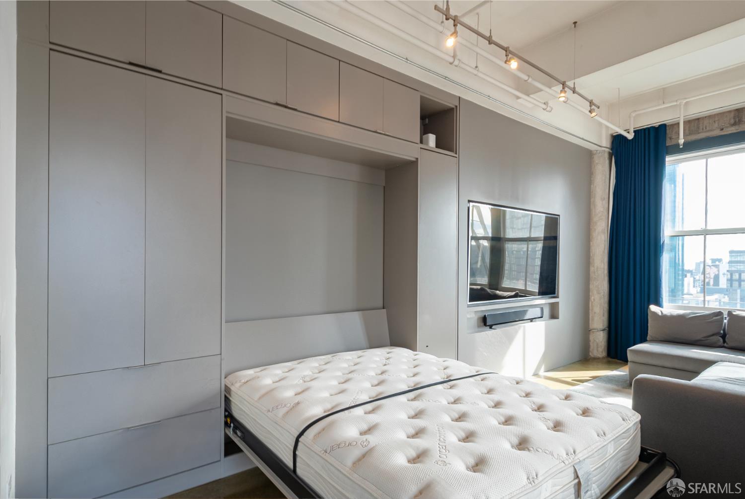 2 Mint Plaza, Unit 905 San Francisco, CA 94103 - Photo 13 of 21 a bedroom with a bed and a couch