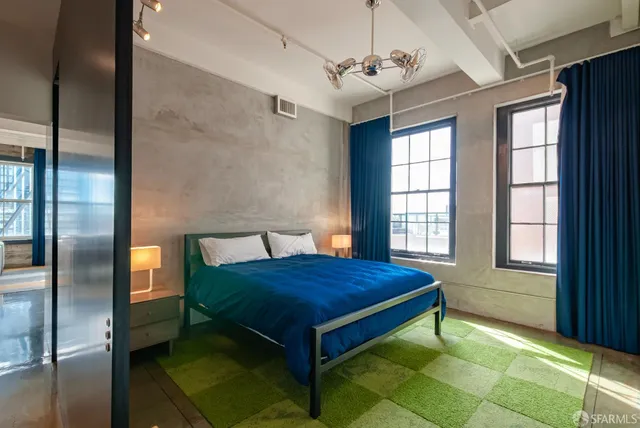 a bedroom with a bed and window