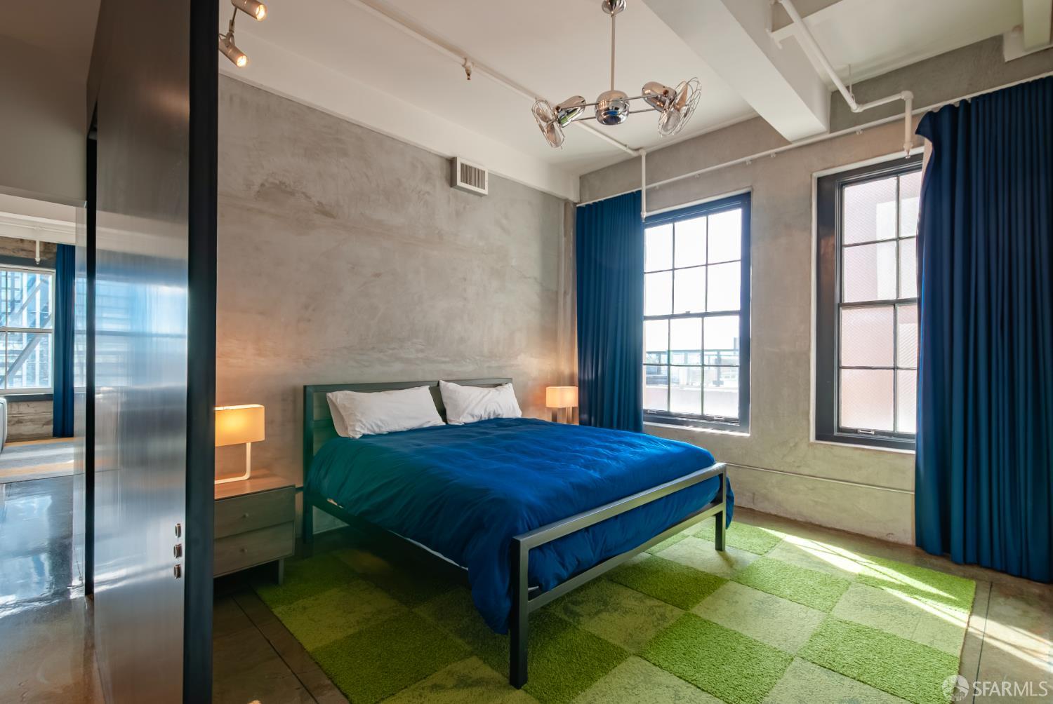 2 Mint Plaza, Unit 905 San Francisco, CA 94103 - Photo 14 of 21 a bedroom with a bed and window